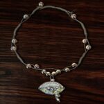 hand-embroidered eye pendant necklace