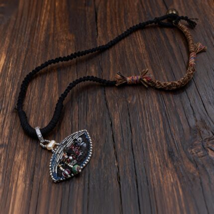 hand-embroidered eye pendant necklace