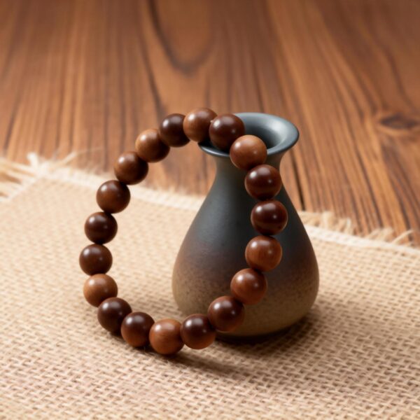Mysore Sandalwood Bracelet 10mm dark grain beads,Sinking grade Indian sandalwood bracelet close up,Natural Mysore sandalwood round bead texture,Oil-rich sandalwood bracelet horizontal grain detail