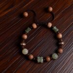 handcrafted cord bracelet,old mountain sandalwood and hetian jade accents