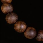 high resin agarwood beads close up natural grain