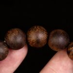 high resin agarwood beads close up natural grain