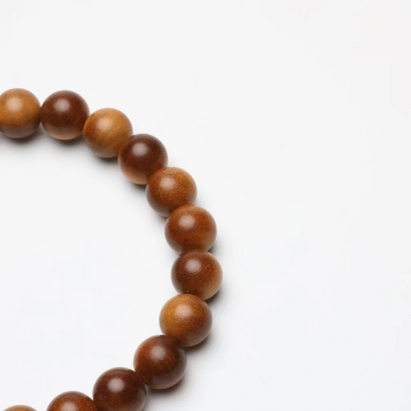 how to choose a sandalwood bracelet on wooden table