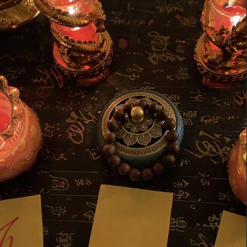 mindful jewelry,agarwood incense burning on wooden table